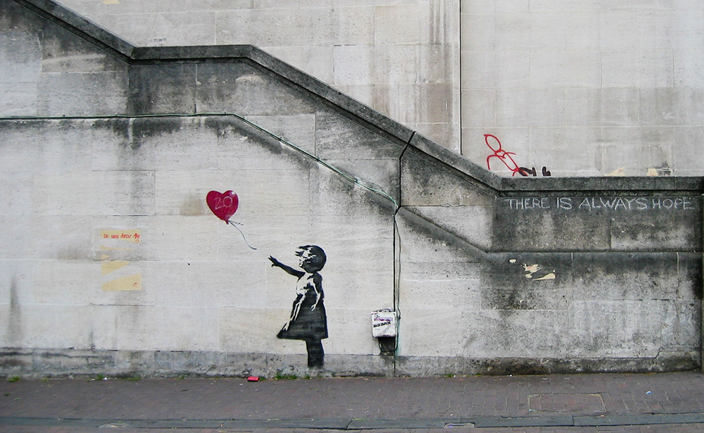 Streetartwerk von Banksy: Mädchen mit einem Ballon.